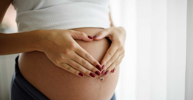 A pregnant woman.