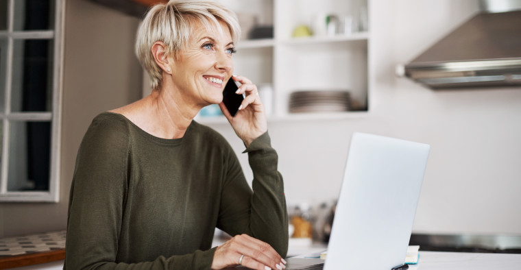 Senior woman chatting about personal finance.
