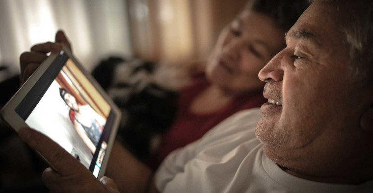 parents on a video call with son