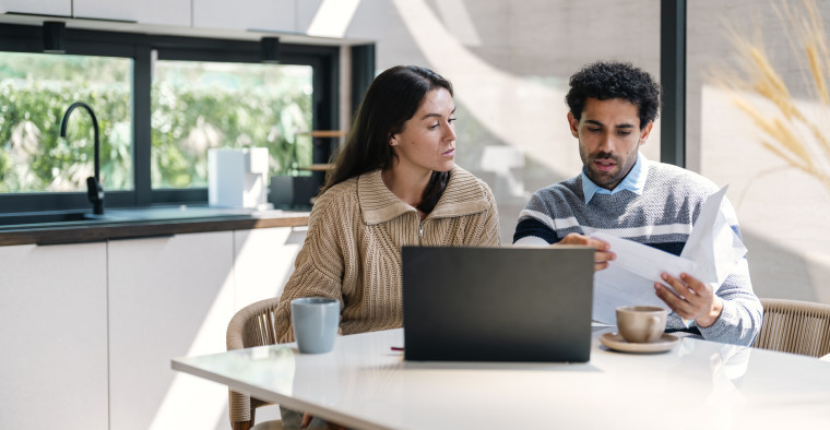 Couple researching health share plans
