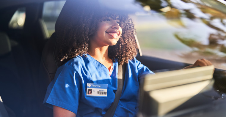 Nurse driving a car