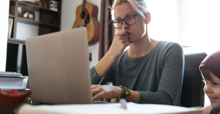 A stressed-out mom works from home.
