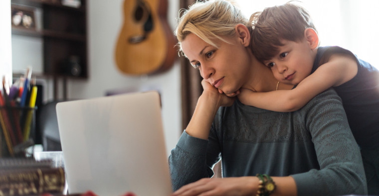 Mother reviewing bills