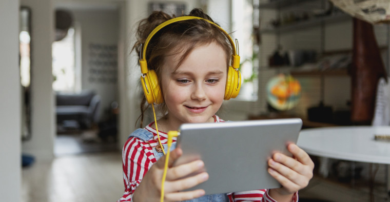 A girl uses her tablet.