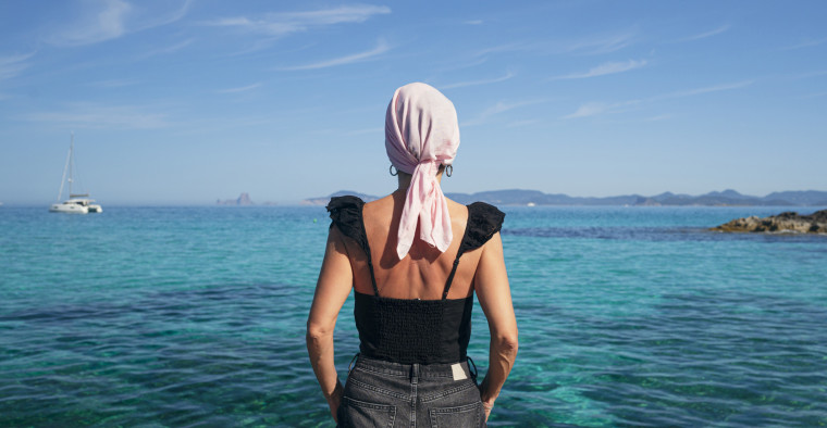 Cancer survivor enjoys the beach.