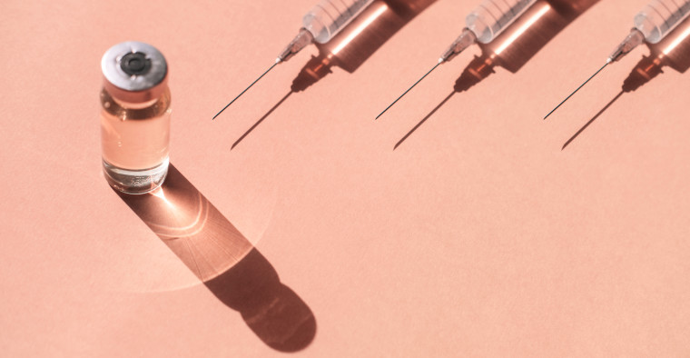 Syringes and a vial of liquid