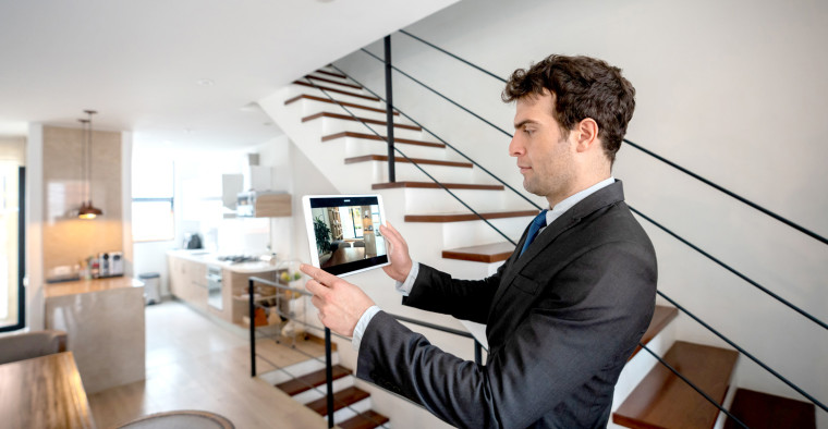 real estate agent showing a house
