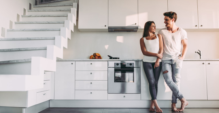 Young couple in their apartment kitchen