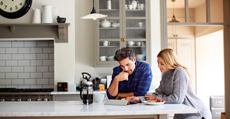 couple in kitchen deciding about freezing eggs