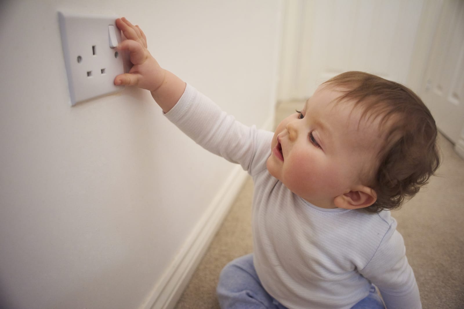 Baby touching socket