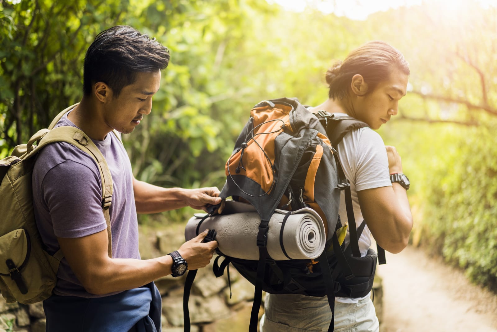 Two friends are gearing up for their hike