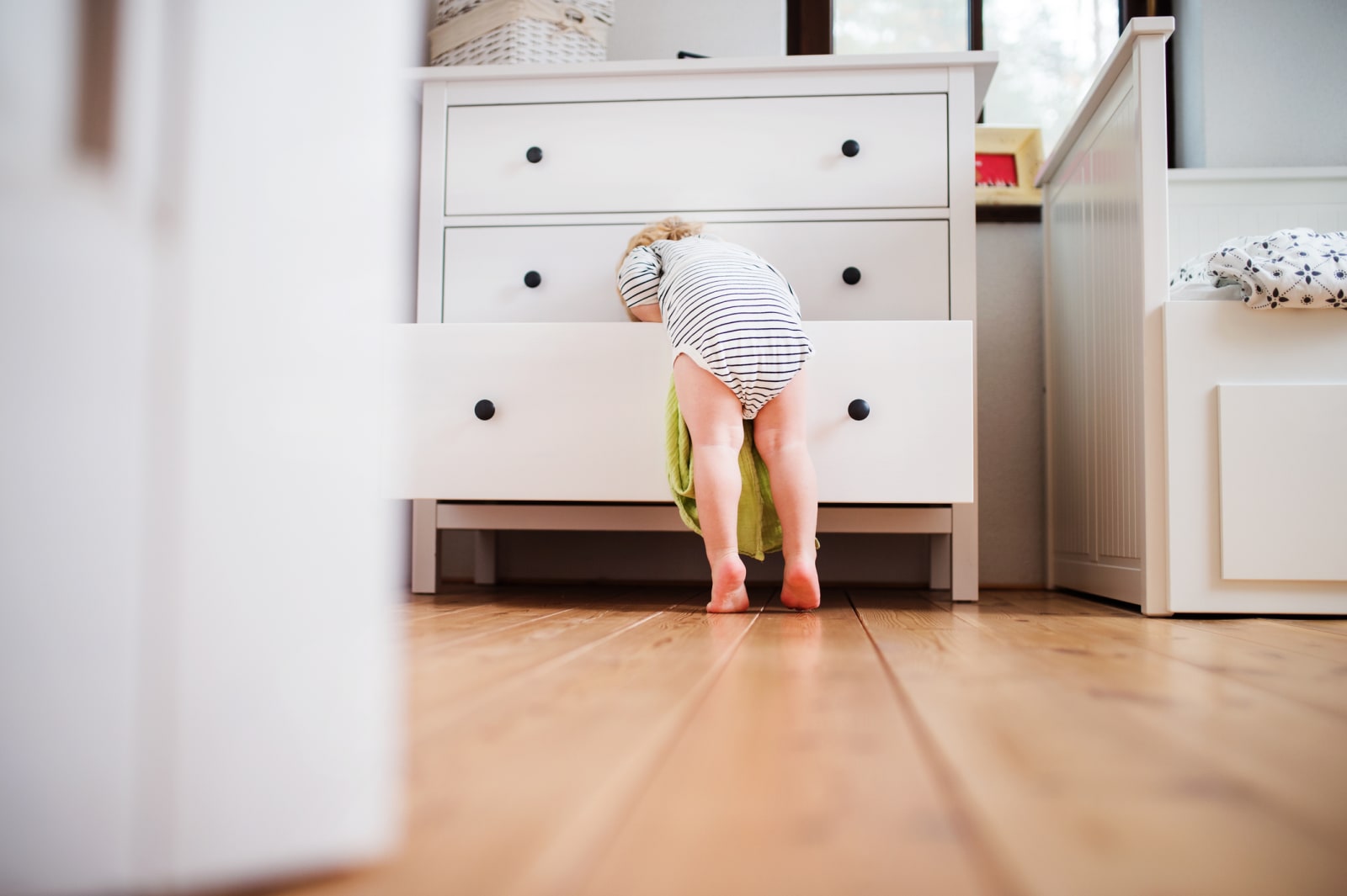 Baby opening drawer