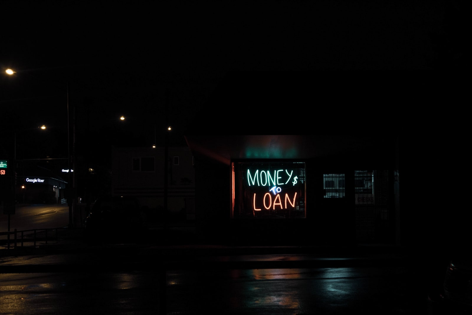 Store with sign that says MONEY $ TO LOAN