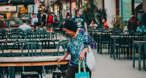 woman looking at ground in singapore street