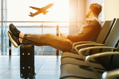 man waiting to fly at airport