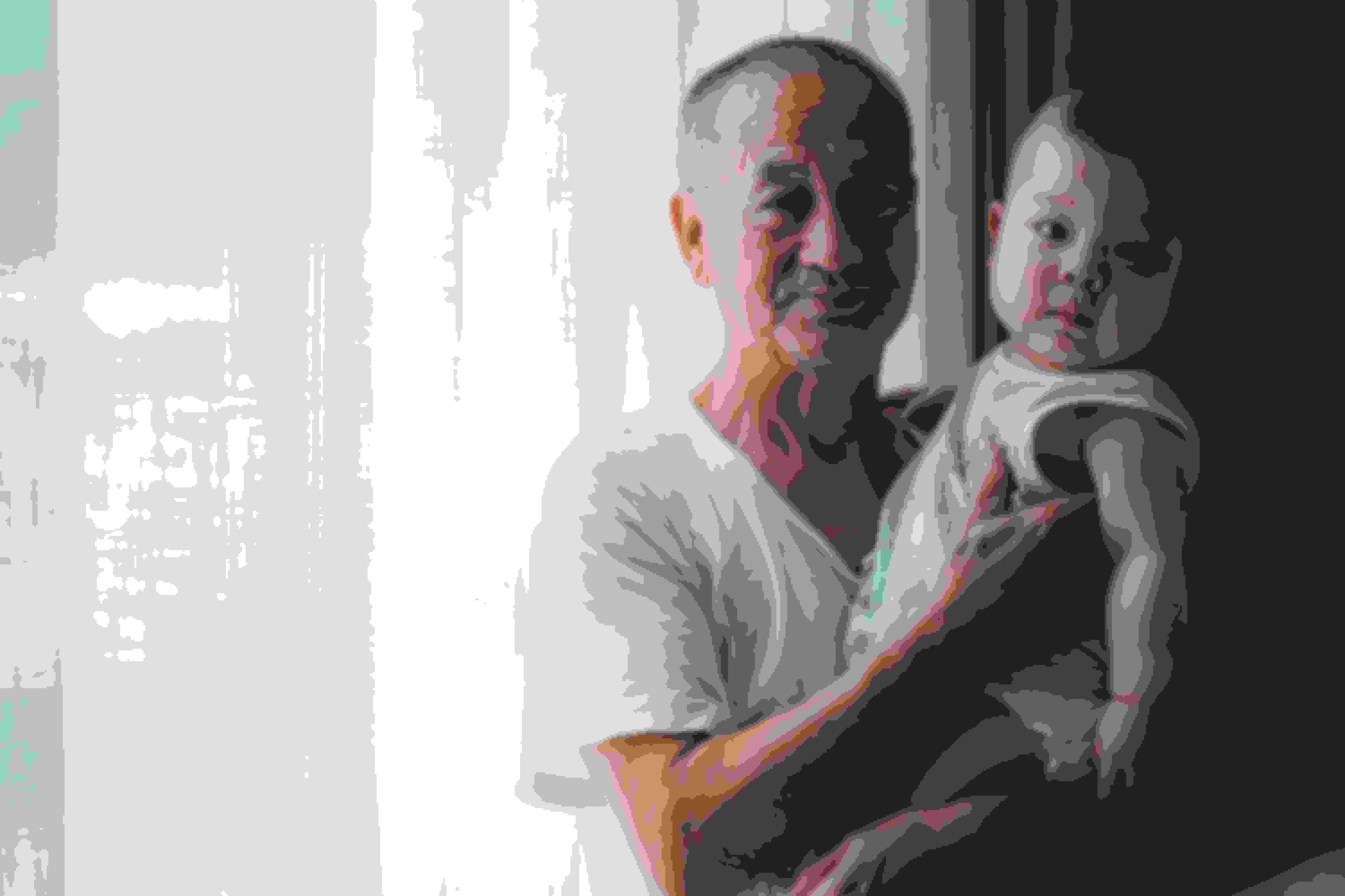 Old man carrying infant or grandparent holding their grandchild