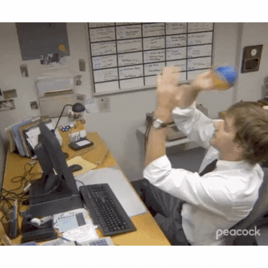 Jim from The Office series playing catch at work