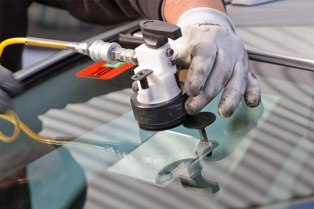 MWT Technicians Repairing Car Windscreen Chip