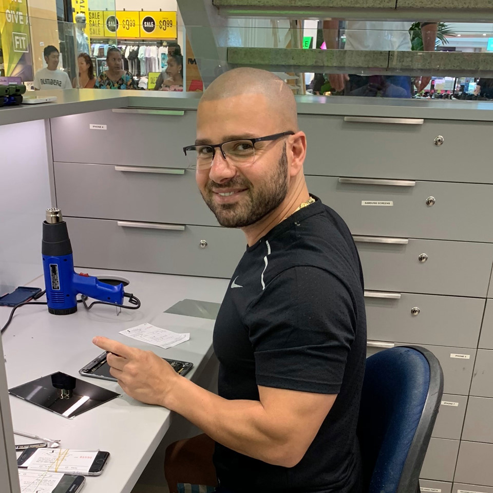 Mobile phone repair technician working