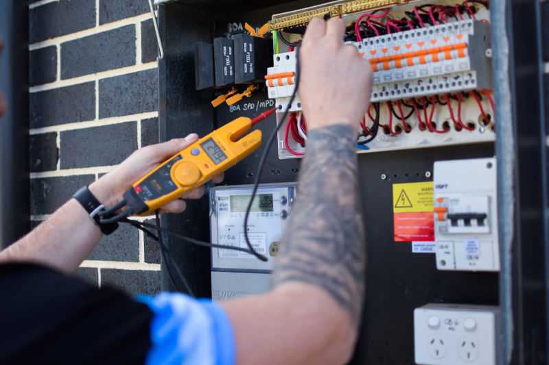 HQ Technician Performing an Electrical Inspection