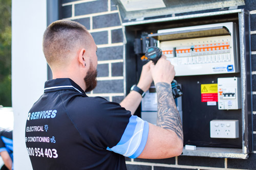 HQ Technician Installing Surge Protectors