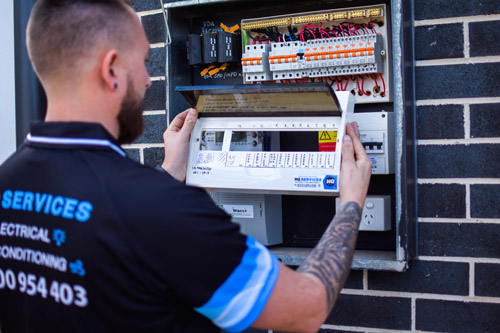 HQ Technician Upgrading and Installing Switchboard