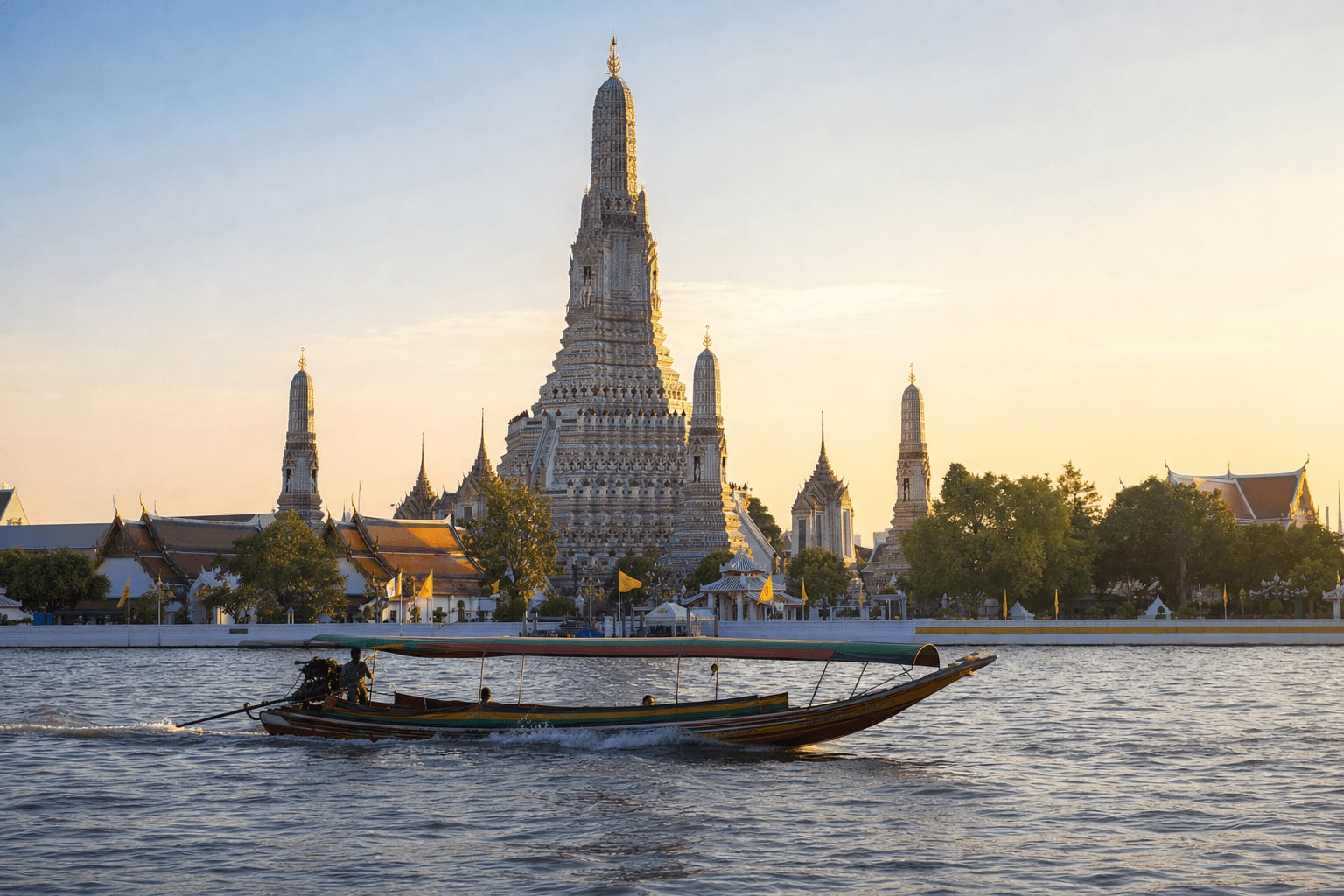 Veetrips Wat Arun temple spire seen from a boat on the Chao Phraya river in Bangkok