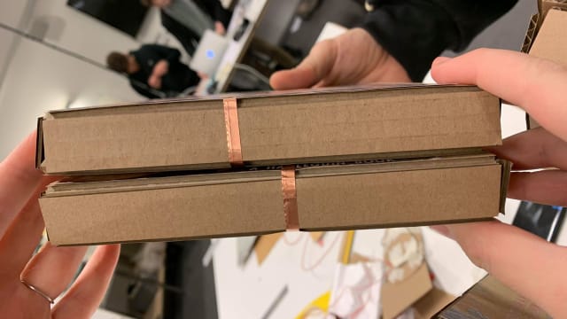 Pattern of copper tape connects the books