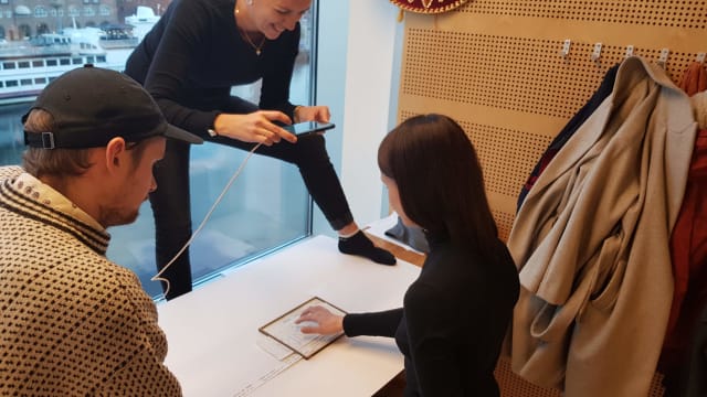 Cathrine, Denisa and Simon are filming a paper prototype