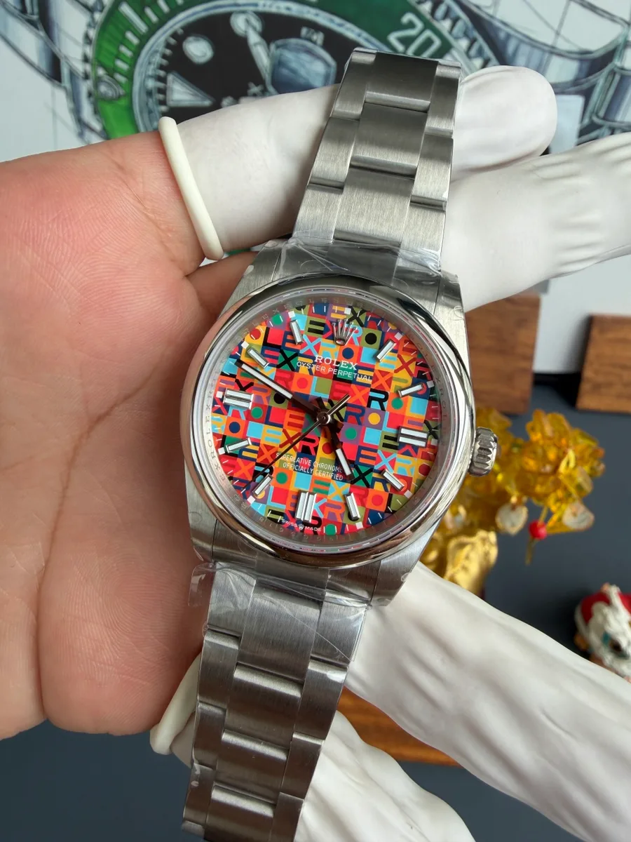 Rolex Oyster Perpetual 126000-0016 Multicoloured Jubilee-Motif Dial QF 36mm Super Clone Watch - Angle 2 - Jack Watches USA