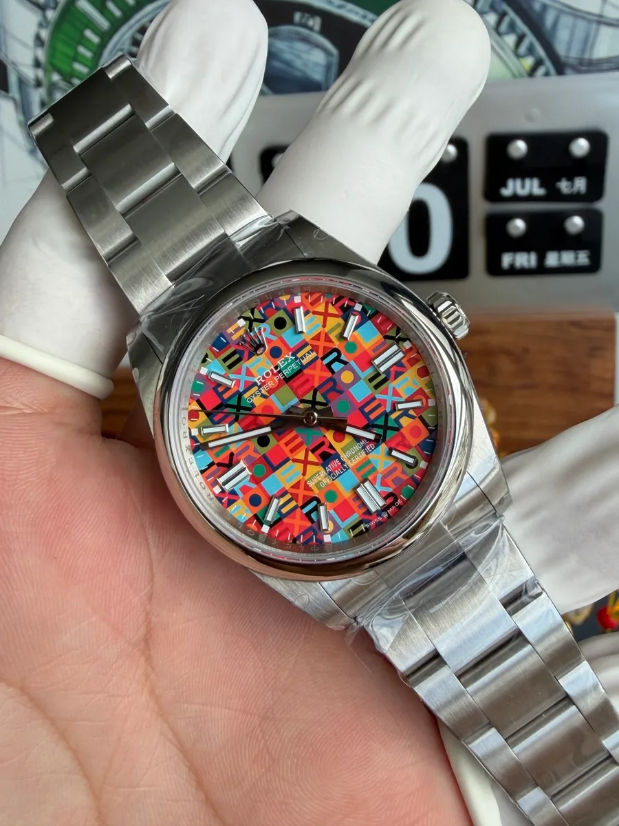 Rolex Oyster Perpetual 126000-0016 Multicoloured Jubilee-Motif Dial QF 36mm Super Clone Watch - Angle 3 - Jack Watches USA