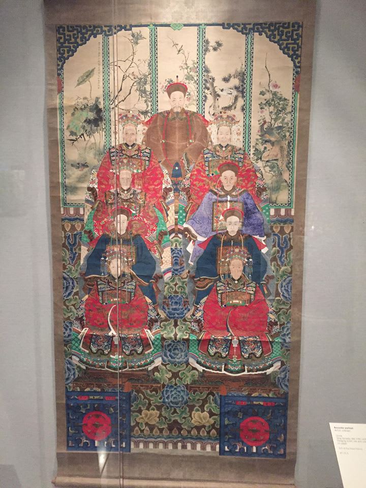 A Chinese painted scroll of seated figures in ceremonial robes