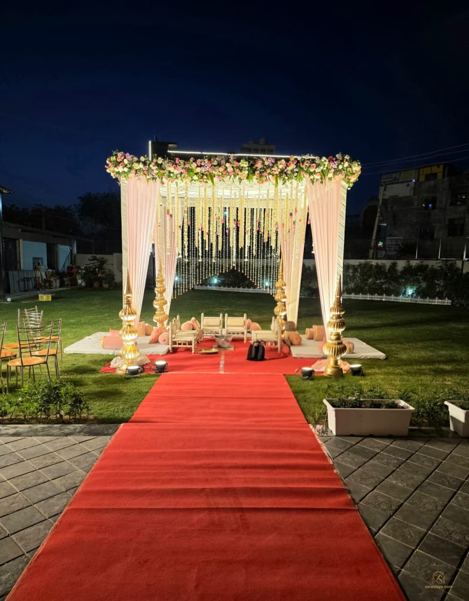 Outdoor ceremony canopy and red aisle