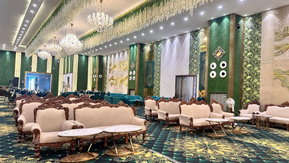 Lounge seating beneath chandeliers in the event hall