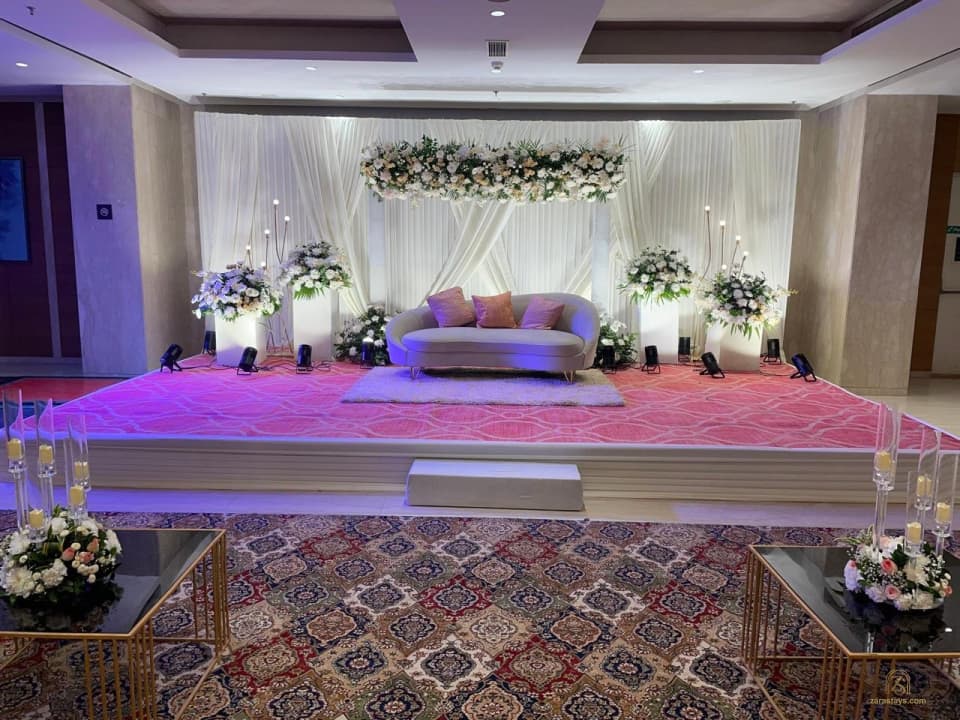 Indoor floral stage and lounge seating