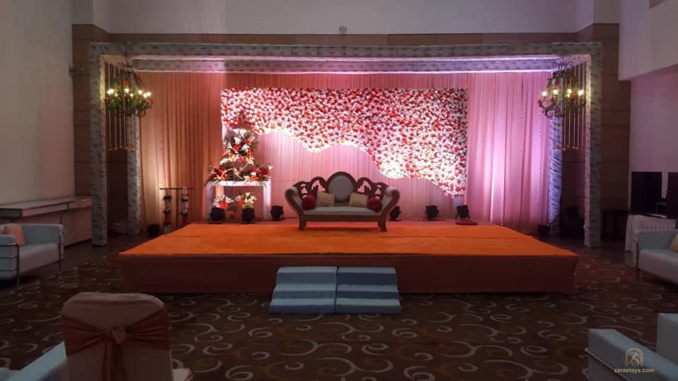 Floral stage in an indoor event room