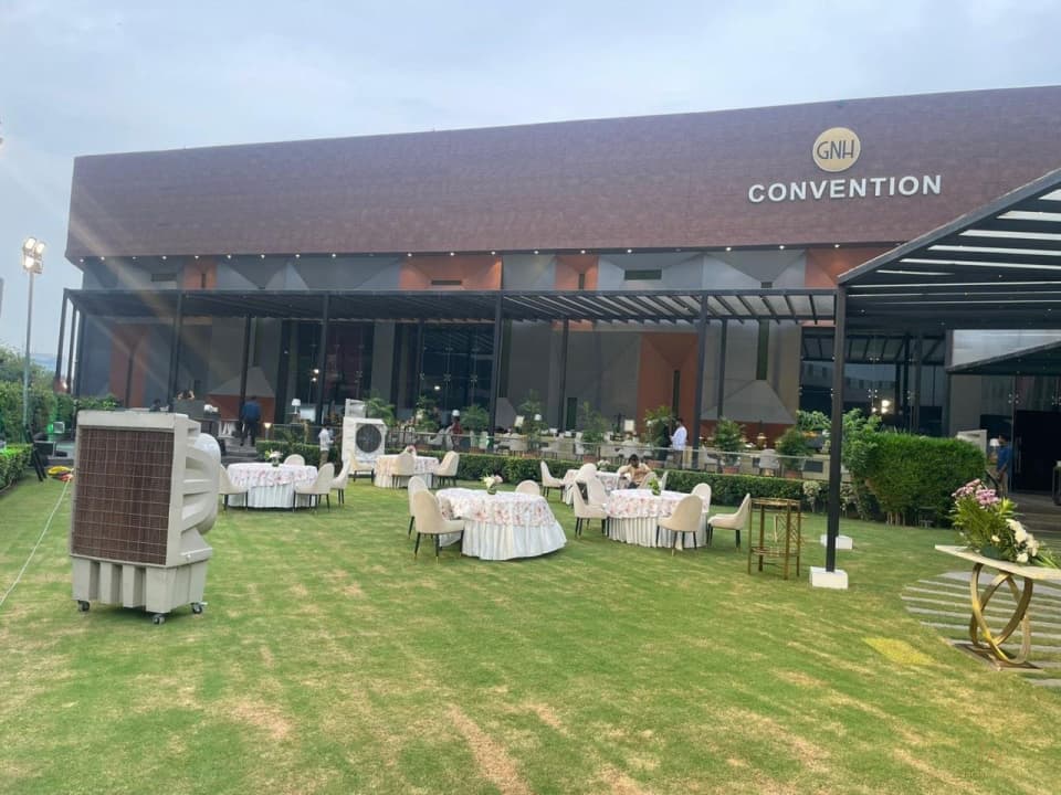 GNH Convention building facing a lawn with seating