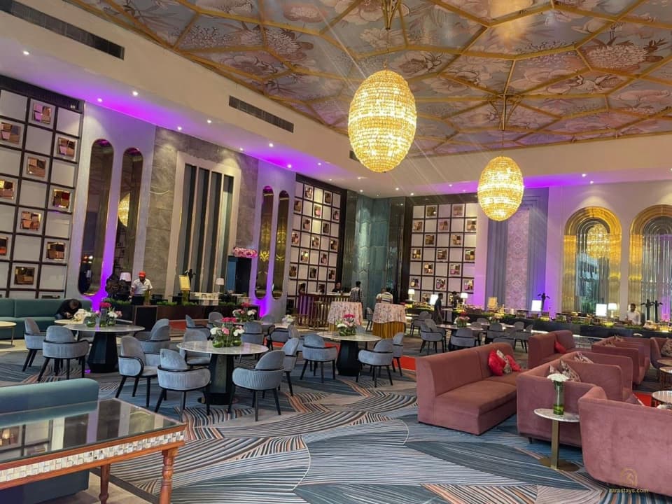 Indoor reception arranged beneath chandeliers