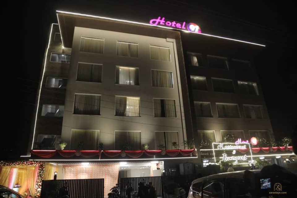 Hotel 91 facade illuminated at night