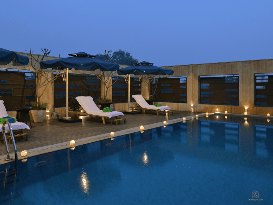 Swimming pool and shaded loungers