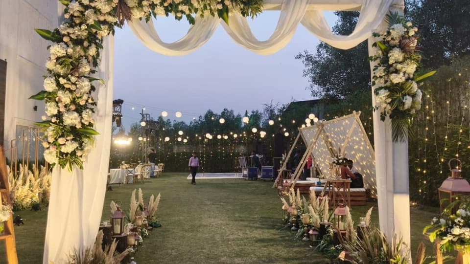 Outdoor celebration with a decorated arch