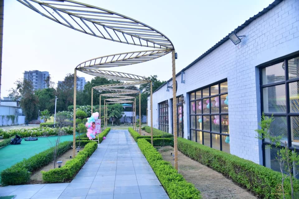 Covered walkway along the glass-fronted hall