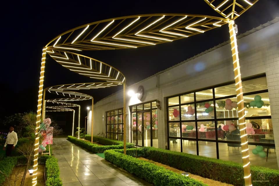 Illuminated walkway beside the event hall
