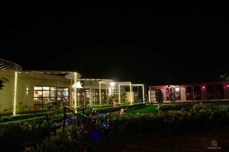 Lawn and event building lit at night
