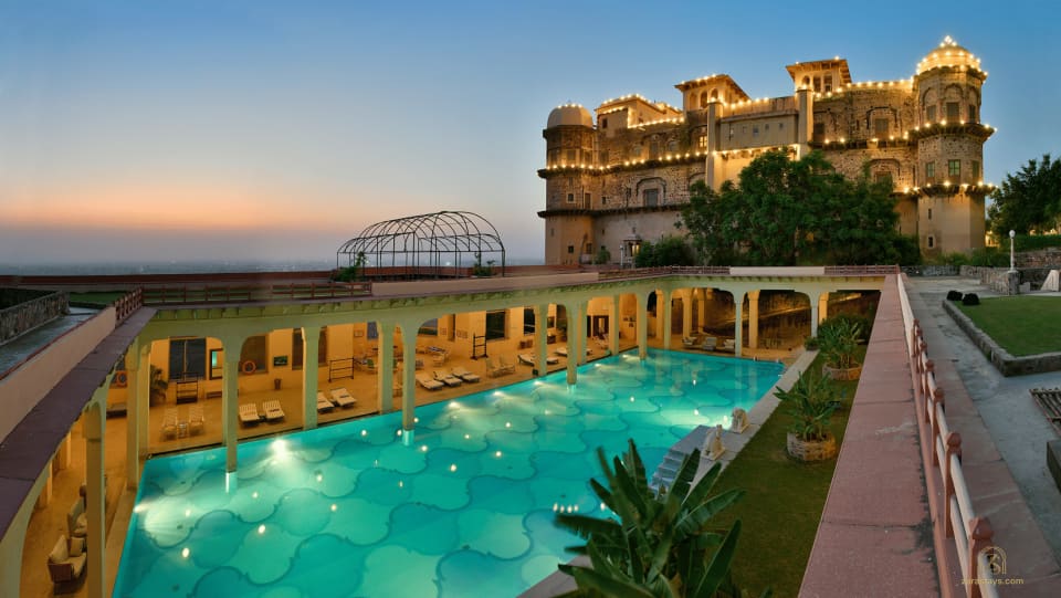 The swimming pool at Tijara Fort-Palace at dusk
