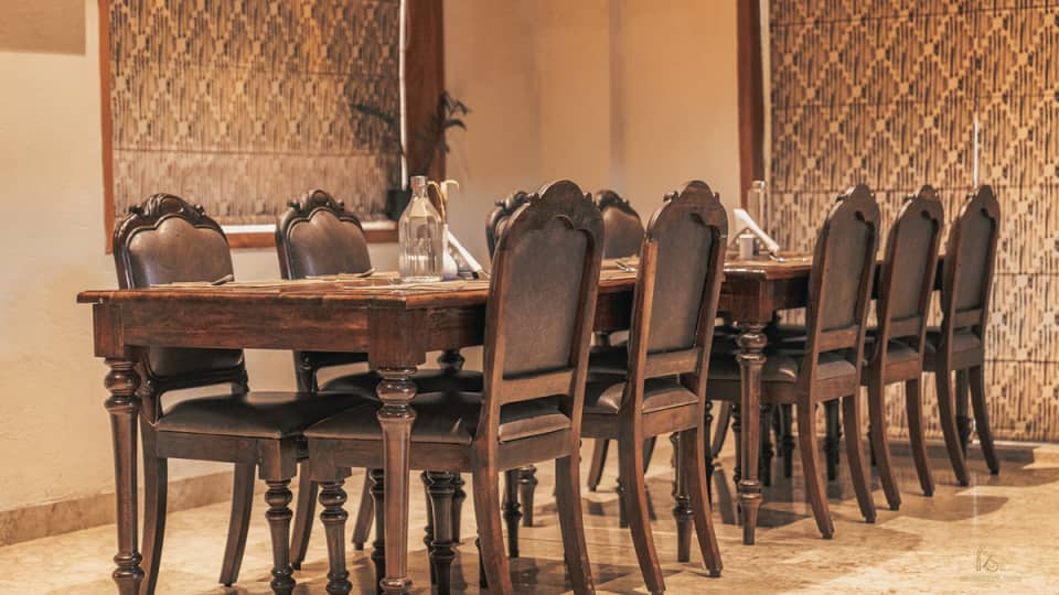 Tables in the dining room at The Baagh Ananta Elite