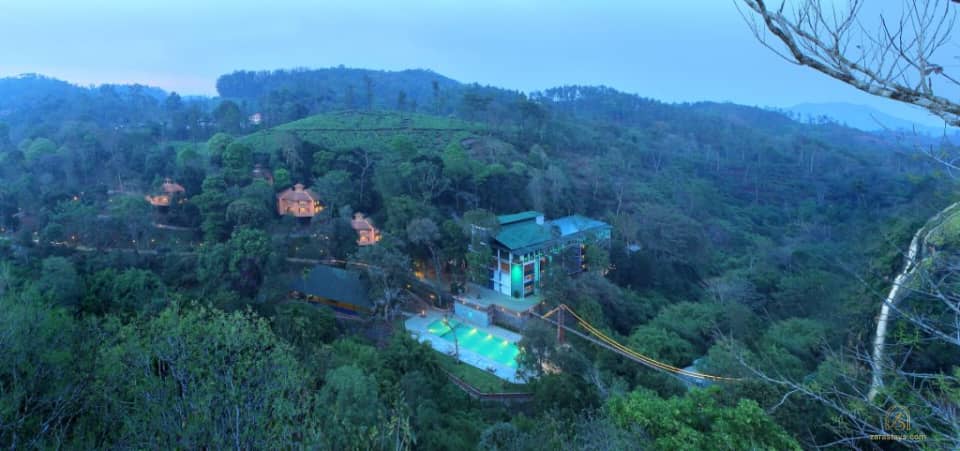 Aerial view of the resort and forested hills at Vythiri Village