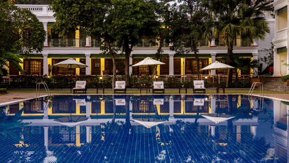 The pool beside the palace colonnade at Jehan Numa Palace