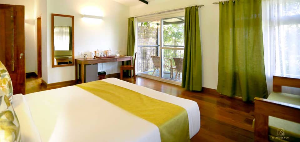 A forest-facing bedroom at Wayanad Wild