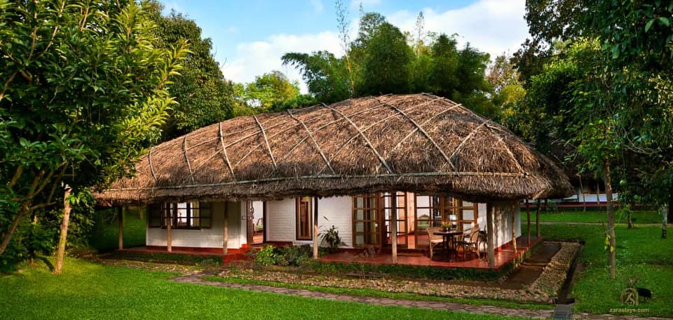 A thatched cottage and garden at Spice Village